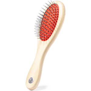 A pet brush with a wooden handle and a red, cushioned head featuring metal bristles.