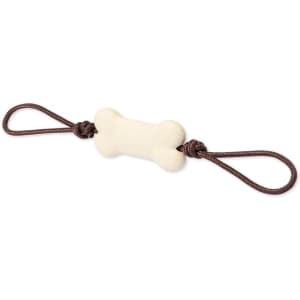 A bone-shaped dog chew toy in cream colour with brown rope handles, featuring a logo.