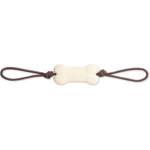 A bone-shaped cream dog chew toy with brown strings on either end, suitable for pets.