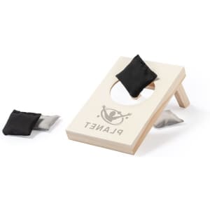 A bean bag toss game set featuring a wooden board with a hole and black and grey bean bags. It includes branding.