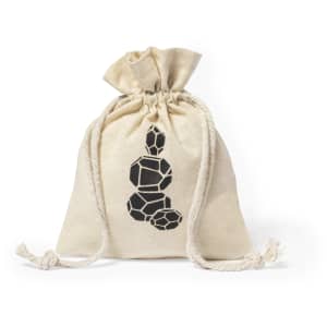 A cream-coloured drawstring bag featuring a black geometric design. It has a simple, rustic look.