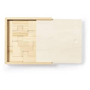 A wooden puzzle game with various shaped blocks arranged inside a light-coloured wooden box with a lid.
