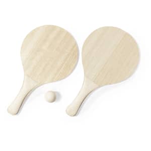 Two wooden beach rackets and a small wooden ball, all in a natural light colour. The rackets have a simple design with smooth handles.