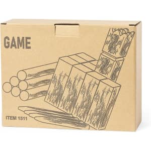 A cardboard box containing game pieces, including wooden blocks and sticks, in natural wood tones. The box has a logo.