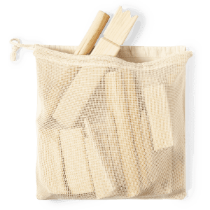 A cream mesh bag containing wooden game pieces, including sticks and blocks. The bag has a drawstring closure.