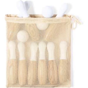 A mesh bag containing eight wooden skittles in a light beige and white colour scheme.