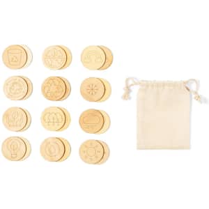Twelve wooden game tokens with engraved symbols in a beige drawstring bag. The tokens feature nature-themed designs.