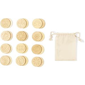 A collection of circular wooden tokens with various engravings, accompanied by a small fabric pouch.