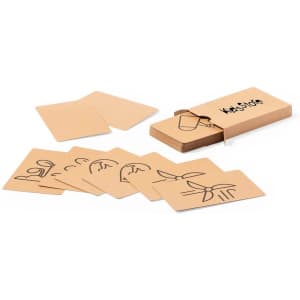 A set of game cards in a box, featuring simple illustrations on a tan background. The box has a logo.