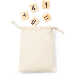 A beige drawstring bag with wooden tiles displaying numbers and symbols scattered around it.