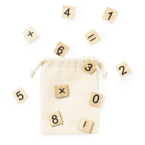 A cotton drawstring bag surrounded by wooden number tiles featuring various mathematical symbols and digits.