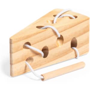 A wooden cheese-shaped skill game with lace holes and a wooden peg, featuring a natural wood finish.