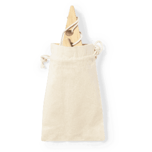 A natural cotton drawstring bag contains a wooden game piece. The bag has a minimalist design and an earthy appearance.