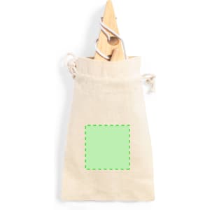 A beige drawstring bag made of fabric, featuring a green square design in the centre.