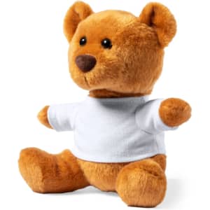 A plush teddy bear in brown with a white T-shirt, featuring a friendly face and soft textures. Includes branding.