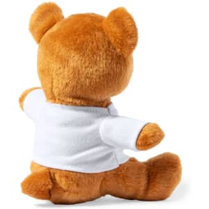 A plush teddy bear with orange fur and a white shirt, sitting with its back facing the viewer.