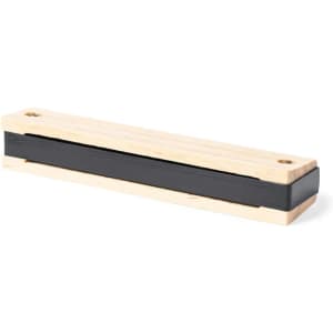 A wooden blues harmonica with a black case, featuring a simple design and a logo.