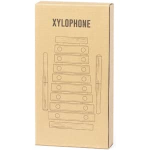 A cardboard box containing a xylophone illustration, featuring wooden bars and mallets, with a simple design.