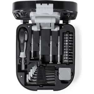 A compact black tool set featuring a screwdriver, multiple bits, and various hand tools neatly organised in a case.