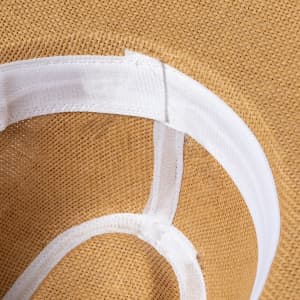 A straw hat featuring a light-coloured band, showcasing a textured tan interior. It has a logo inside.