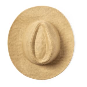 A straw hat in a natural beige colour, featuring a wide brim and a deep crown. It has a logo on the side.