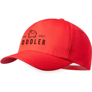 A red cap with a curved brim, featuring branding and text, designed for toddlers.