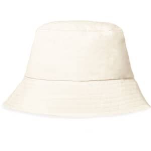 A cream bucket hat with a wide brim, featuring a textured fabric and a simple design. Includes a logo.