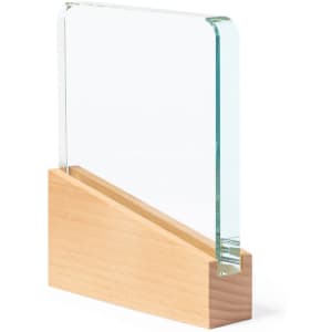 A clear glass plaque with a wooden base, featuring a sleek and modern design.