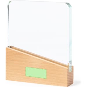 A clear glass plaque with a wooden base. The base is light brown, and the plaque features a logo.