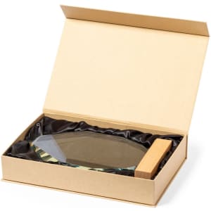 A glass plaque with a wooden base, presented in a gift box lined with black fabric.