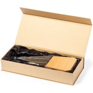 A wooden plaque and a glass trophy presented in a gold box with black satin lining.