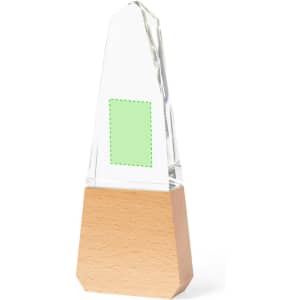 A trophy with a clear glass top and a wooden base, featuring a blank area for engraving.