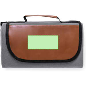 A grey picnic blanket with a brown handle and a logo or branding area on the flap.