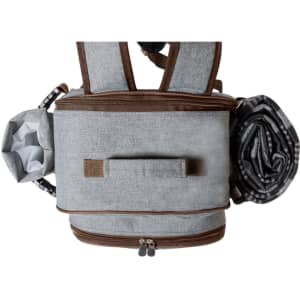 A grey picnic cool bag backpack with brown accents, featuring a foldable blanket and a side drink bottle holder.