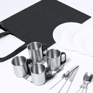 Four stainless steel mugs, a black bag, plates, and cutlery arranged on a white background.
