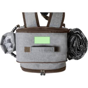 A grey cooler bag backpack with brown accents, featuring a rolled-up picnic blanket and an attached bottle holder.