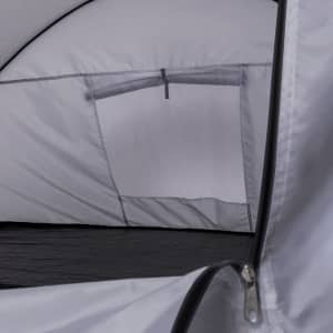 A grey tent interior featuring a mesh window and zip. The floor appears black. Contains a logo.