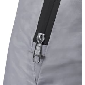 A close-up of a grey tent zipper featuring a black outline and a metal pull tab. The fabric has a subtle texture.
