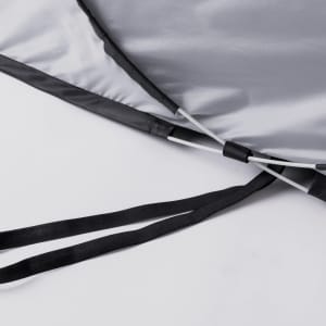 A grey tent with black straps and poles, featuring a sleek design and a logo.
