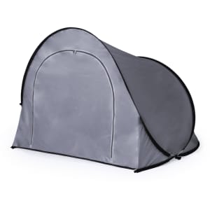 A grey tent with a rounded shape and an entrance, featuring a simple design and branding.