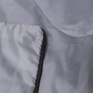 A grey Daltom sleeping bag with a zipper and smooth fabric texture.