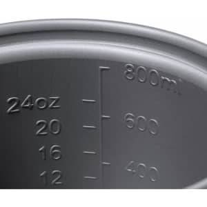 A dark grey measuring cup with markings for ounces and millilitres, featuring a capacity of 800 ml.