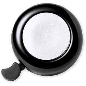 A black bike bell with a shiny silver circular surface and a small lever on the side.