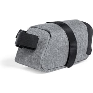 A grey bike bag with a black strap, featuring a textured fabric design and a compact shape.