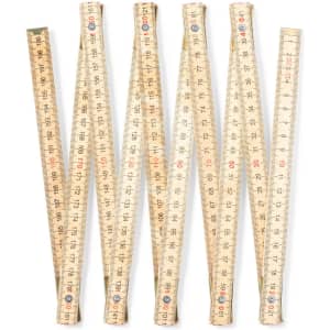 A set of wooden folding rulers in a light colour, displayed in a fan shape, each marked with measurements.