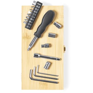 A black and silver tool set displayed on a bamboo base, including a screwdriver, various sockets, and hex keys.