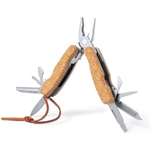 A multitool with silver metal and cork handles, featuring pliers, blades, and various tools, with a brown leather strap.