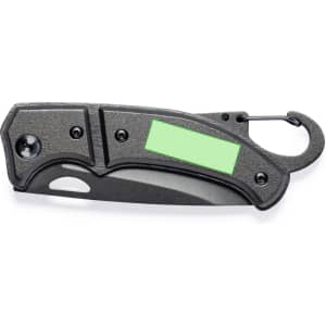 A black pocket knife with a carabiner clip and a blank green label area. It features a textured grip and safety lock.