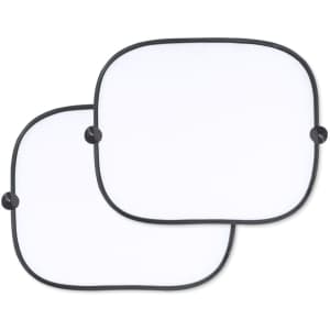 A pair of white sunshades with black edges and suction cups for attachment.