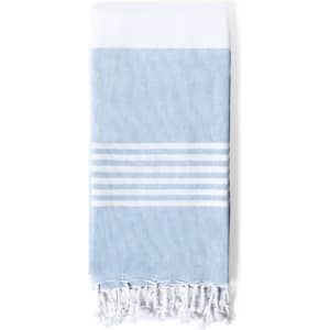 A light blue towel pareo with white stripes and fringed edges. It features a logo.